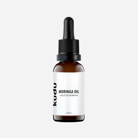 An amber glass bottle of organic Moringa face oil. Kudu Cosmetica