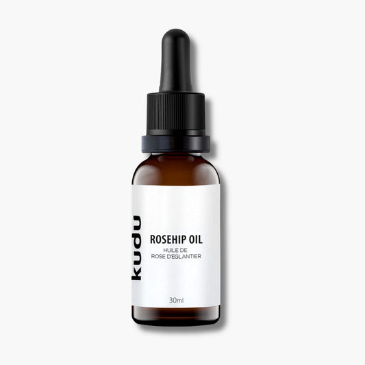 A bottle of Kudu Cosmetica Rosehip oil for skin on a plain background