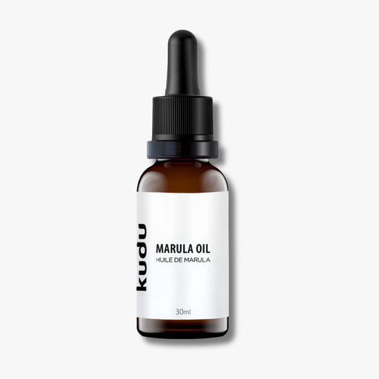 An amber dropper bottle of Kudu Cosmetica Marula Oil for Face on a plain background