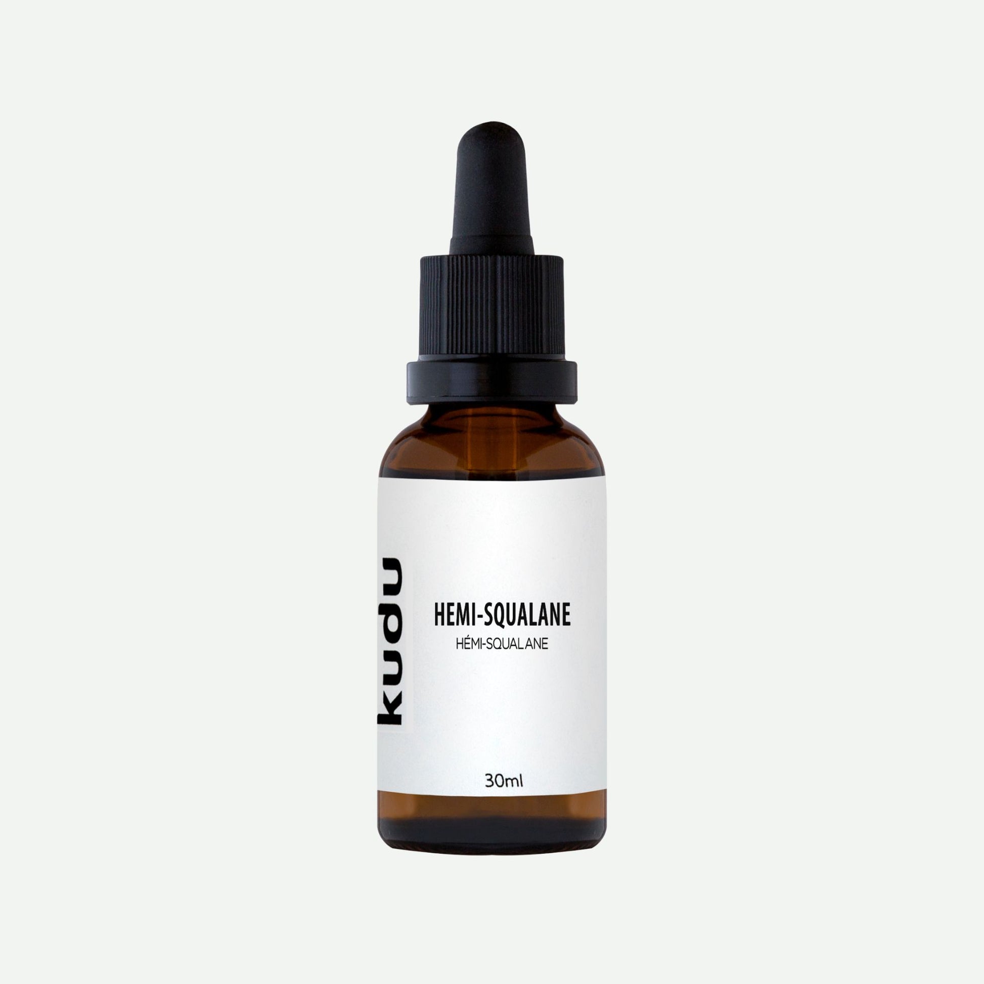 A dropper bottle of Kudu Cosmetica Hemi Squalane on a plain background.