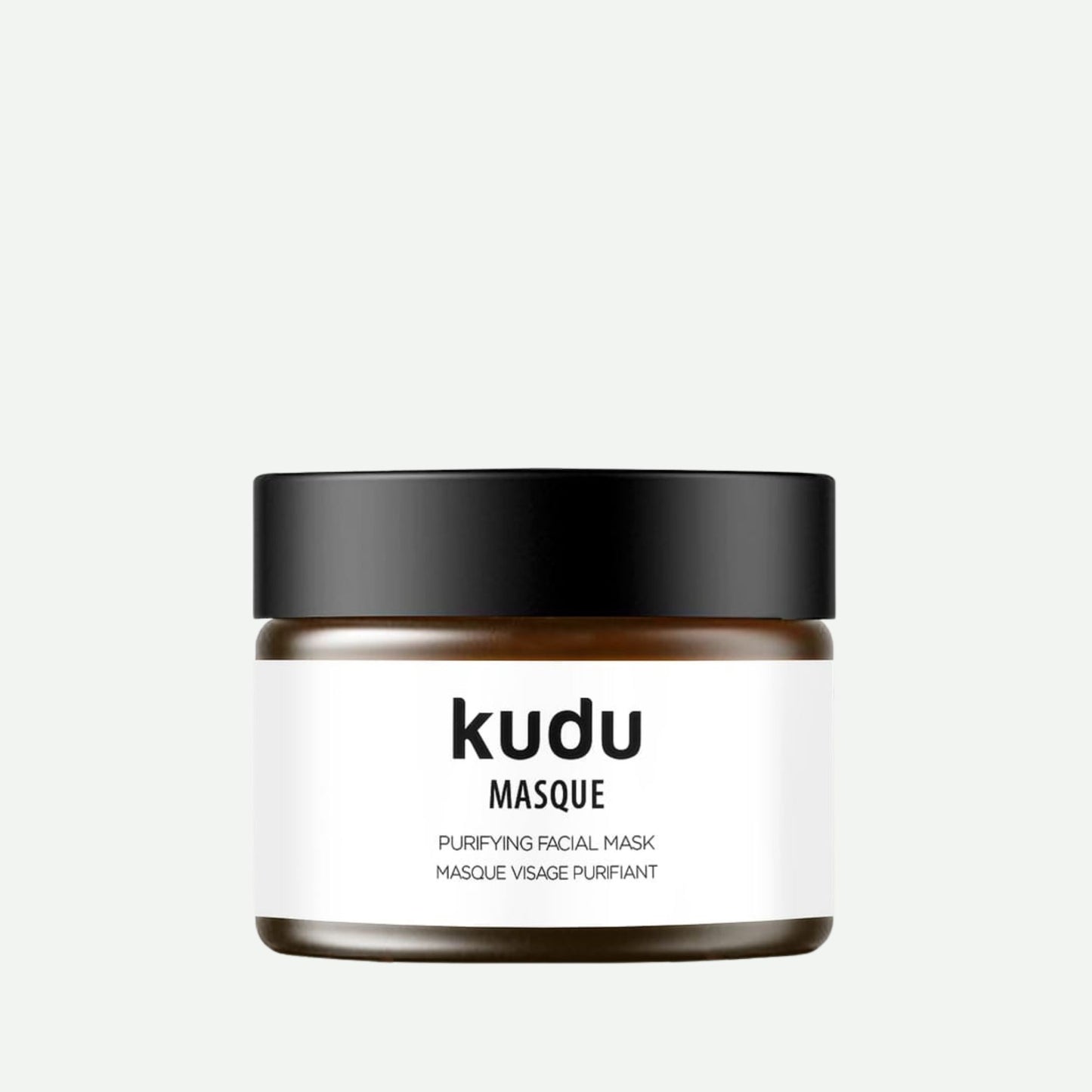 Kudu Cosmetica Purifying Face Mask in an amber glass jar on a plain background.