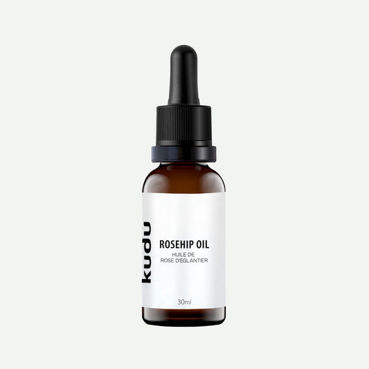 A bottle of Kudu Cosmetica Rosehip oil for skin on a plain background