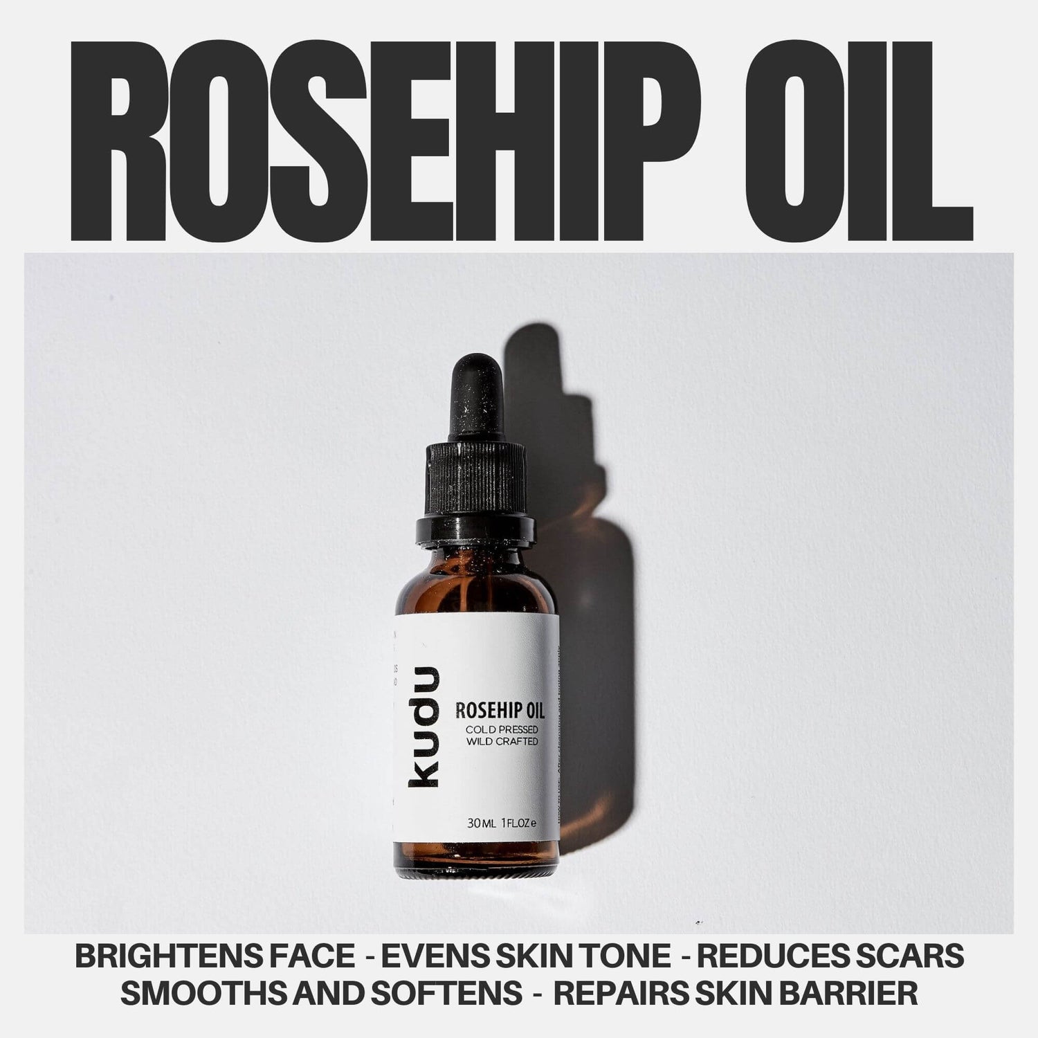 A bottle of Kudu Rosehip Oil with a dropper, casting a shadow on a light surface. Bold text above reads "ROSEHIP OIL," and benefits are listed below.